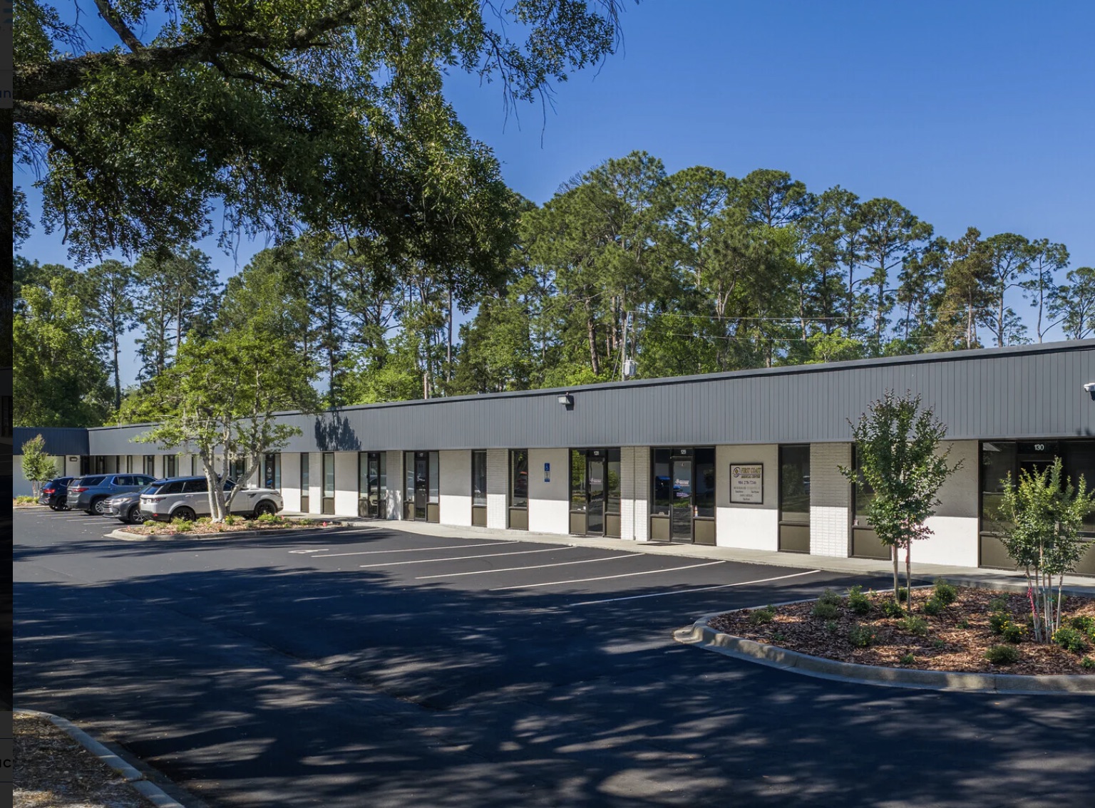 The Village Green office buildings beneath mature trees